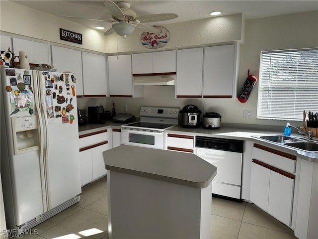 kitchen featuring white cabinetry, ceiling fan, a kitchen island, white appliances, and light tile patterned floors