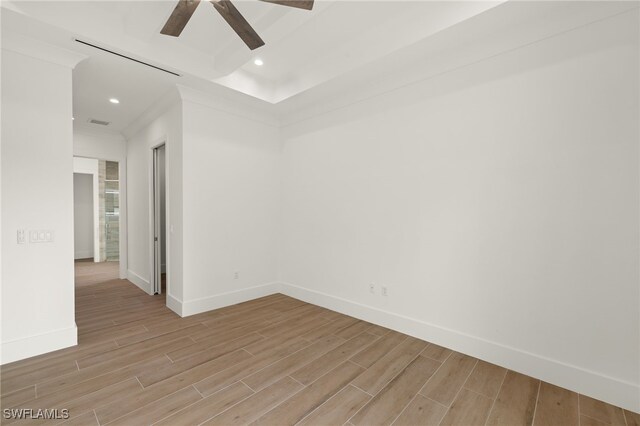 spare room featuring ceiling fan and light hardwood / wood-style floors