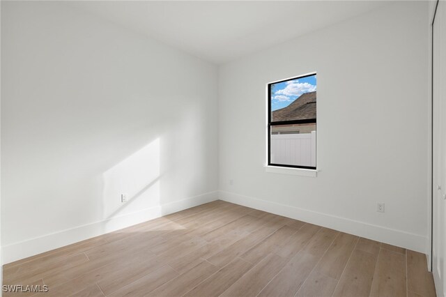 spare room with light wood-type flooring