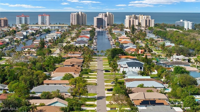 birds eye view of property with a residential view and a water view