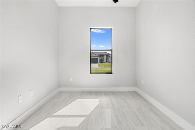 unfurnished room featuring light hardwood / wood-style flooring