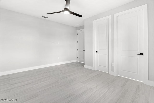 unfurnished bedroom featuring ceiling fan