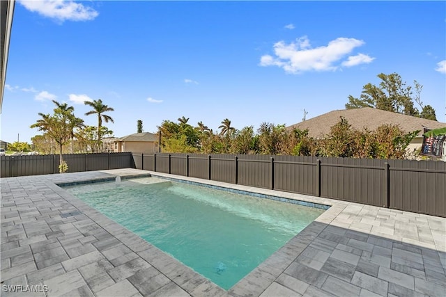 view of swimming pool with a patio