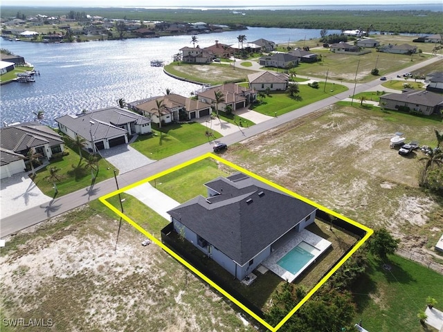 birds eye view of property featuring a water view