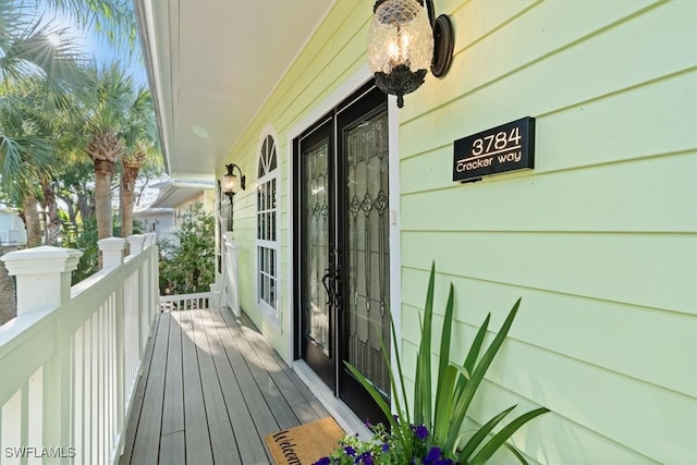 wooden terrace with a porch