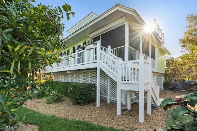 view of property exterior featuring a deck