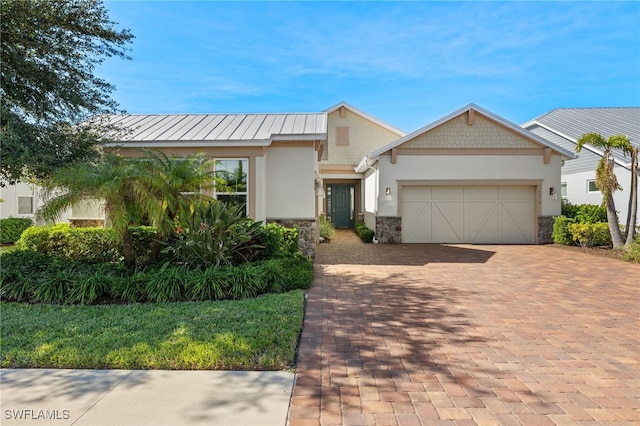 view of front of home with a garage