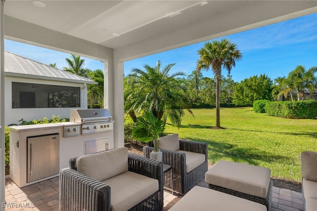 view of patio with an outdoor kitchen and area for grilling