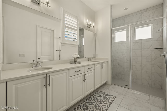 bathroom with a tile shower and vanity