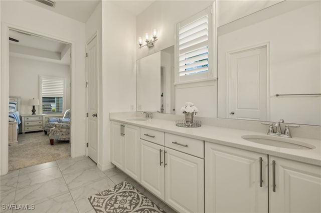 bathroom featuring plenty of natural light and vanity