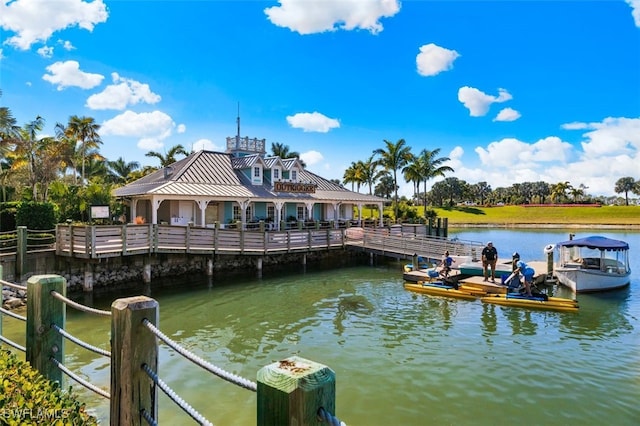 view of dock with a gazebo and a water view