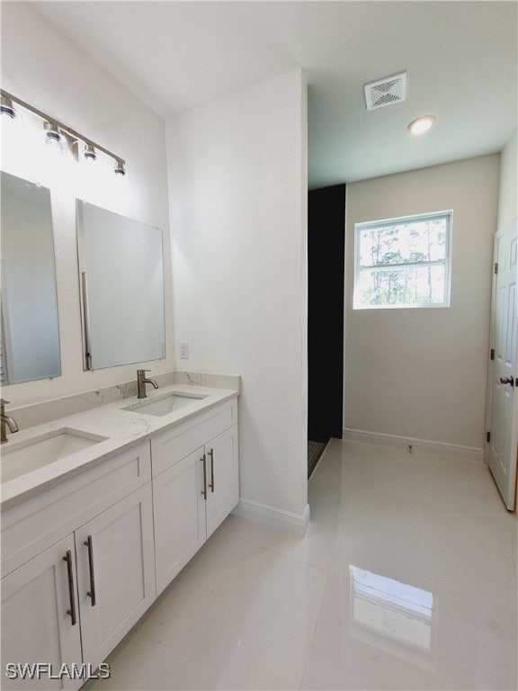 bathroom featuring tile patterned floors and vanity