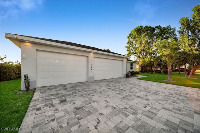 garage with a lawn