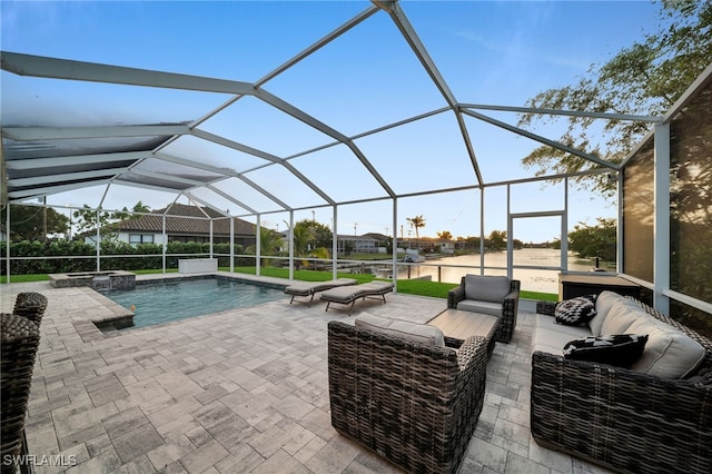 view of swimming pool featuring a lanai, an outdoor hangout area, and a patio