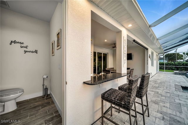 view of patio / terrace featuring a lanai