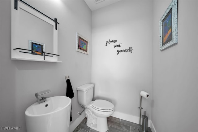 bathroom featuring toilet