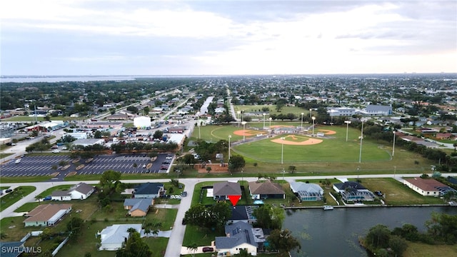 birds eye view of property featuring a water view