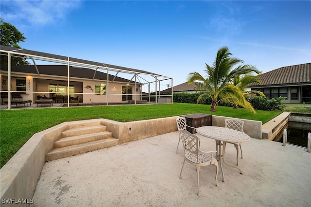 view of patio / terrace featuring a lanai