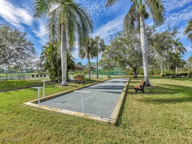 view of home's community with a lawn