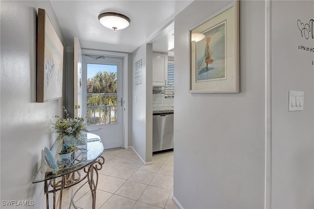 doorway to outside featuring light tile patterned floors