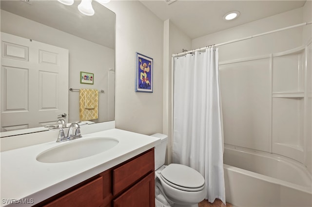 full bathroom with vanity, shower / bath combination with curtain, and toilet