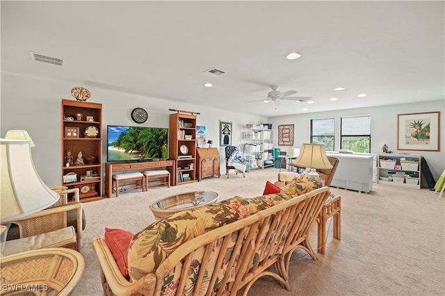 living room with ceiling fan and light carpet