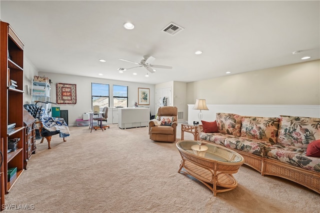 living room with carpet flooring and ceiling fan