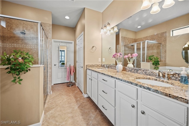 bathroom with tile patterned flooring, vanity, and a shower with door