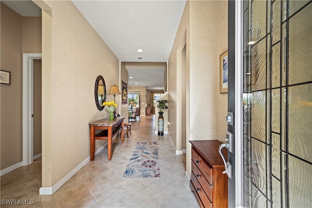 foyer entrance with light tile patterned flooring