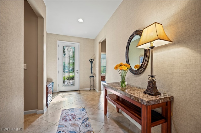 foyer featuring light tile patterned flooring