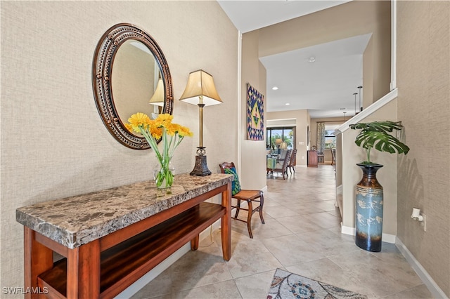 hall with light tile patterned flooring