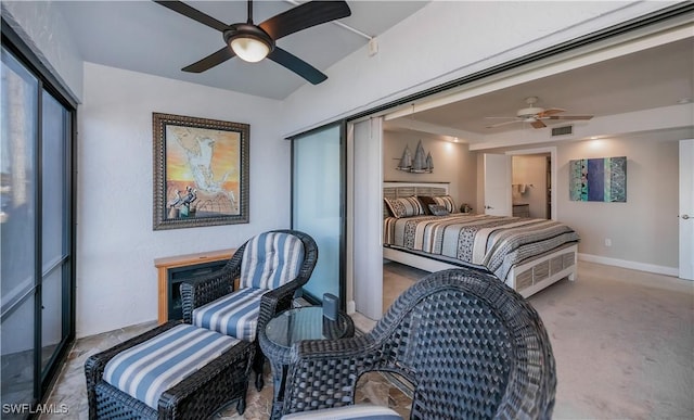 carpeted bedroom with ceiling fan and a closet