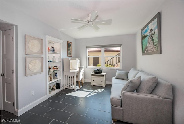 sitting room featuring ceiling fan