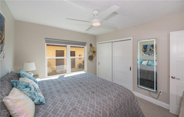 bedroom with ceiling fan, a closet, and carpet flooring