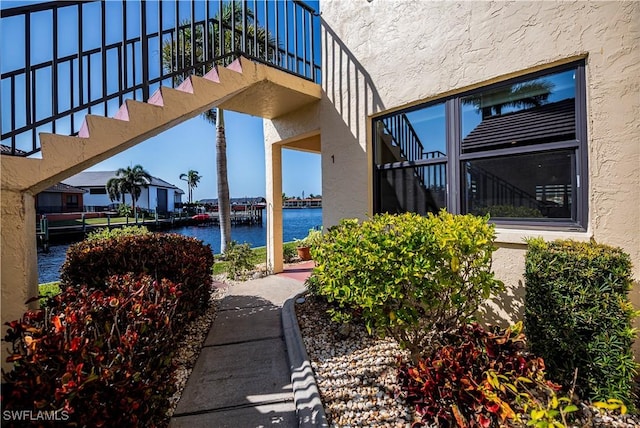 view of patio with a water view