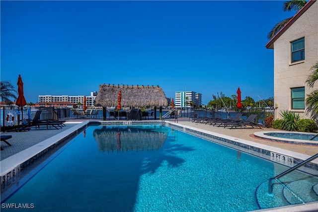 view of pool featuring a patio and a community hot tub