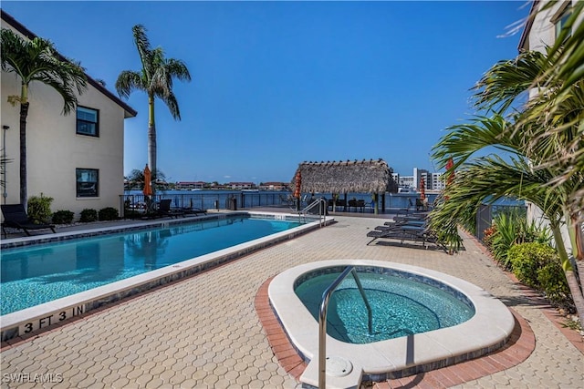 view of pool with a community hot tub