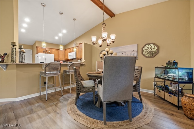 dining area with beamed ceiling, a notable chandelier, light hardwood / wood-style floors, and high vaulted ceiling