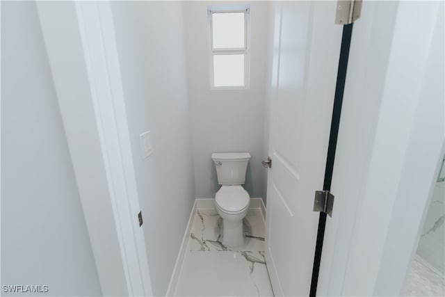 bathroom featuring toilet