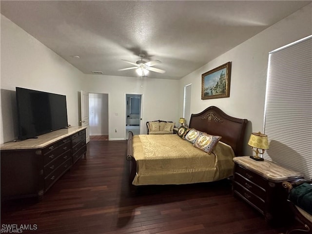 bedroom featuring ceiling fan and dark wood-type flooring