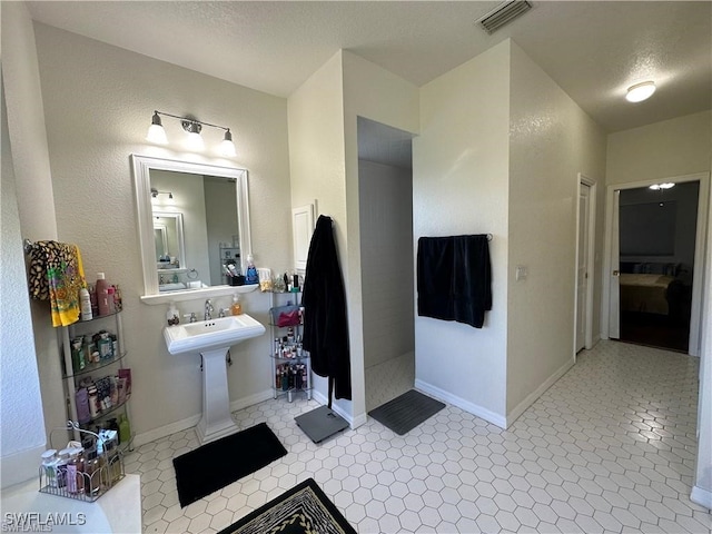 bathroom featuring a textured ceiling