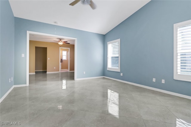 unfurnished room featuring ceiling fan and vaulted ceiling