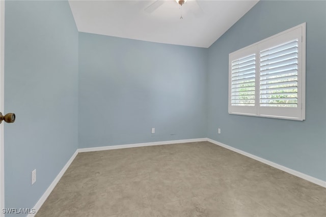 empty room featuring vaulted ceiling and ceiling fan