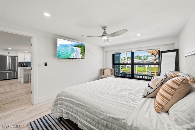 bedroom featuring light wood finished floors, recessed lighting, a ceiling fan, baseboards, and stainless steel refrigerator