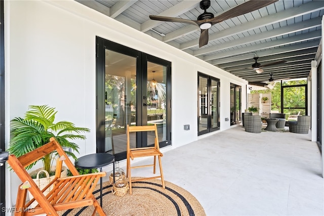 view of patio / terrace featuring ceiling fan and french doors