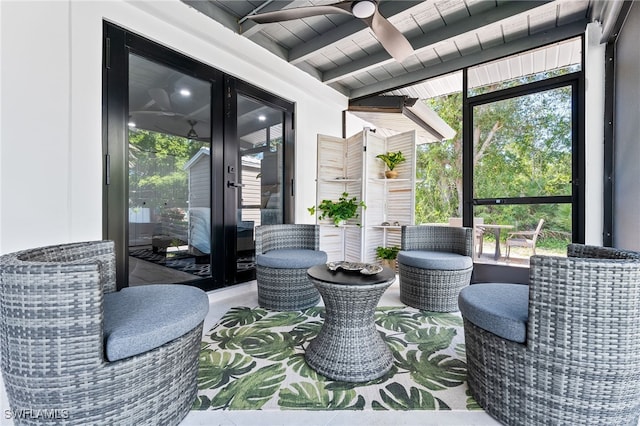 sunroom featuring beamed ceiling