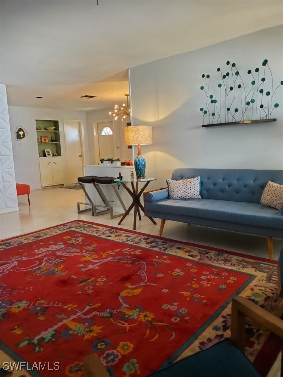 living room featuring an inviting chandelier