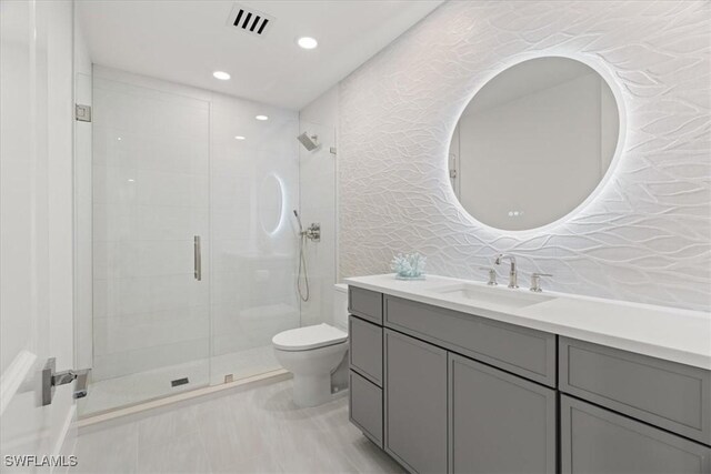 4951 Bonita Bay Blvd Unit 2205, Bonita Springs, FL 34134 - bathroom featuring toilet, a shower stall, vanity, and recessed lighting