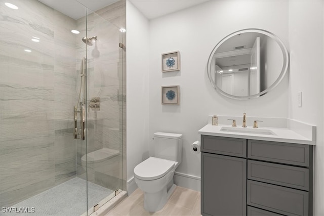 bathroom with tile patterned flooring, vanity, toilet, and a shower with door