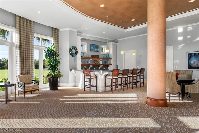 4951 Bonita Bay Blvd Unit 2205, Bonita Springs, FL 34134 - carpeted dining room with ornate columns, a high ceiling, crown molding, recessed lighting, and a tray ceiling